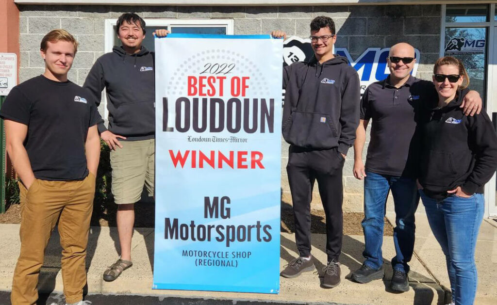 MGMotorsports Team Photo standing for photo with best of Loudoun winner banner